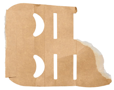 Torn piece of brown cardboard on a white isolated background, close upの写真素材