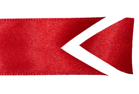 Piece of red silk ribbon with sharp end on isolated background, decorの写真素材