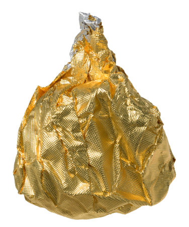 Ball of crumpled golden foil on isolated background, close upの写真素材