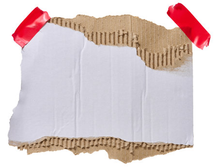 Torn piece of white corrugated cardboard attached to red piece of electrical tape, isolated backgroundの写真素材