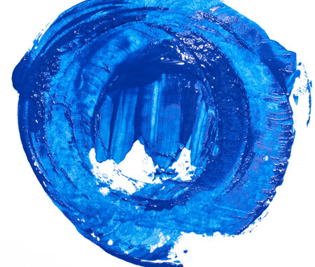 Circle painted with blue watercolor paint on white backgroundの写真素材