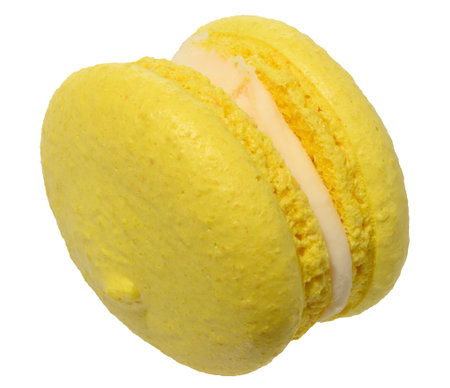Yellow macaron with a creamy white filling, isolated background. Close upの写真素材