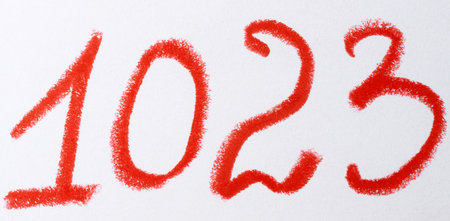 A number written in red chalk or pastel on a white background, with the texture of the strokes...