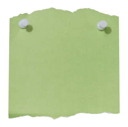 A sheet of green paper with jagged edges attached with two white pushpins on an isolated backgroundの写真素材