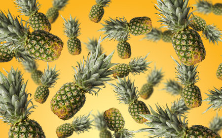 Collage of many whole pineapples flying on a bright orange and yellow gradient background.の写真素材