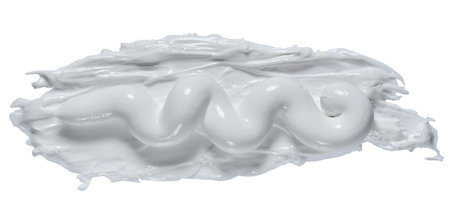 Smear of thick white paint or cream with a raised texture on a isolated background, top viewの写真素材