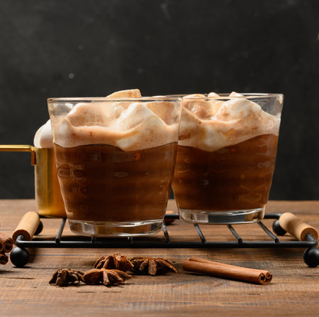 Hot chocolate with fluffy marshmallows on a wooden board. A close-up of the winter drink