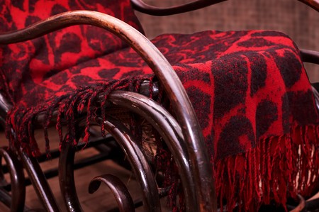 Old wooden rocking chair with red plaid
の写真素材