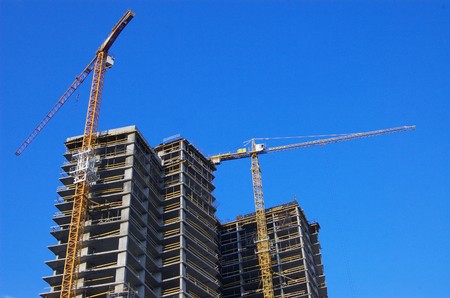 New high block costruction. Two building cranes at work.