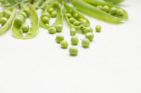 Green peas on linen background