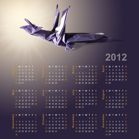 Symbol of 2012 year - Dragon made from paper (Origami) and calendar for full year