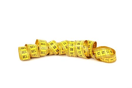 yellow measuring tape isolated with soft shadow over white background