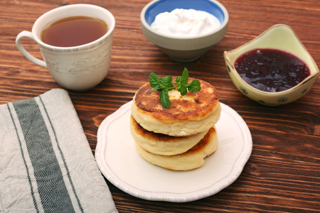 Cheese pancakes fried in a pan.の写真素材