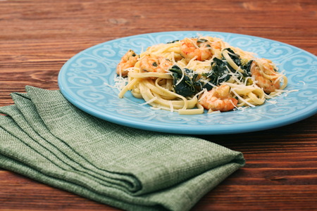 pasta with shrimps, spinach and parmesanの写真素材