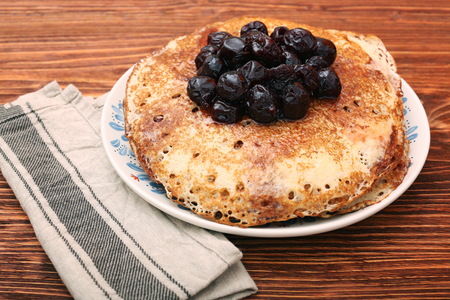 Delicious pancakes with cherry jam