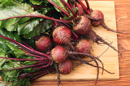 Fresh vegetables beetroot on wooden background.