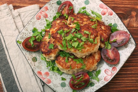 Chicken cutlets on wooden background. Healthy eating concept.