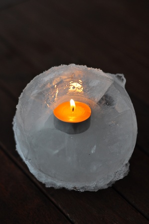 A burning candle in the ice standの写真素材