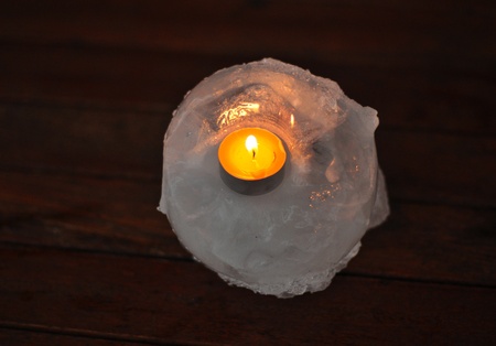 A burning candle in the ice standの写真素材
