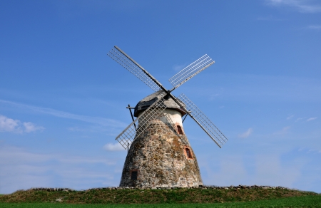 A windmill standing on the hillの写真素材
