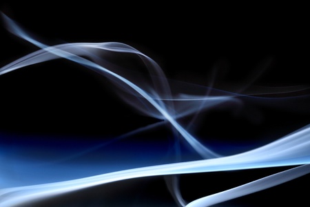 Blue smoke in black backgroundの写真素材