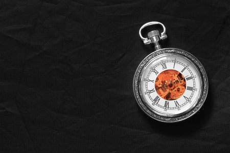 Old watch machine on dark background