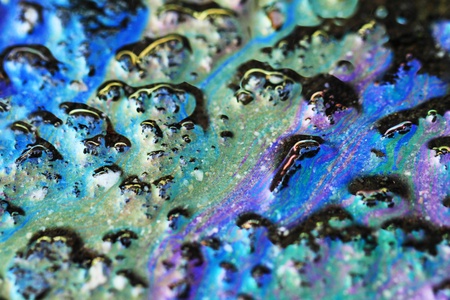 Color gasoline fuel spot on black asphalt, industrial details conceptの写真素材