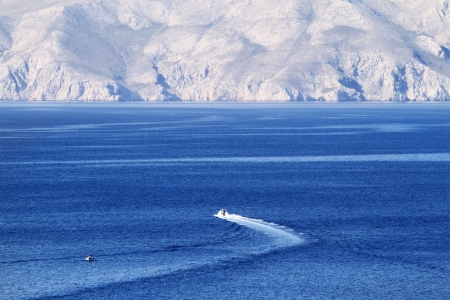 Famous strong northern wind bura blowing over the sea in front of krkの写真素材