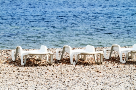 plastic chairs at a beautiful beach  Vis Island の写真素材