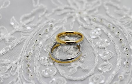 Wedding rings, pearls and tulle fabricの写真素材