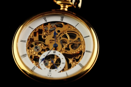Old watch machine on dark backgroundの写真素材