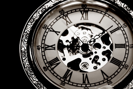 Old watch machine on black background