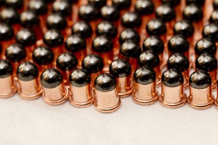Gun bullets over white background