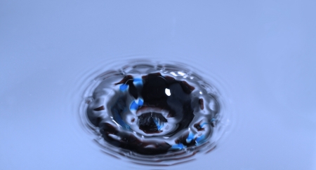 Blue Water Drop Splashing with Wavesの写真素材