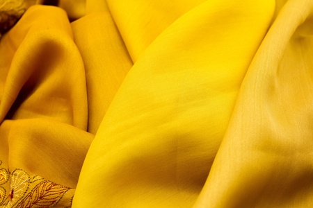 Golden satin textile background  close up の写真素材