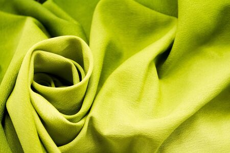 Green satin textile background  close up の写真素材