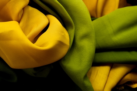 Golden and green satin textile background  close up の写真素材