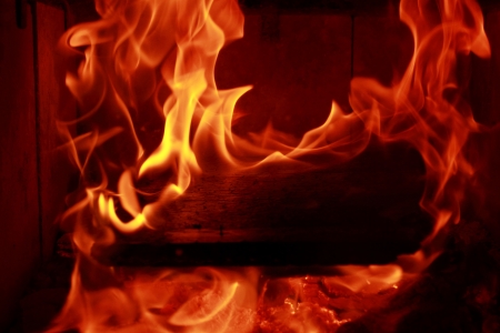 Fire flames with reflection on black backgroundの写真素材