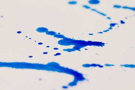 Blue splatter on white backgroundの写真素材