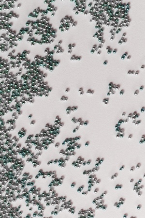 Pile gray and green balls of bead suitable for Background and textureの写真素材