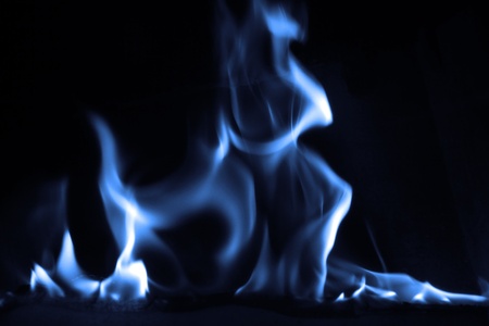 Blue flame isolated on dark backgroundの写真素材