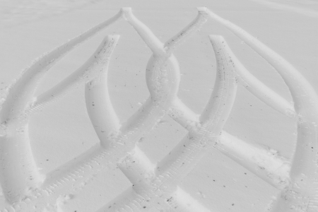 Traces from wheels of the car on snow