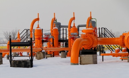 Orange gas pipe in frosted winterの写真素材