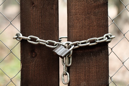 Old lock on the wood door of color brownの写真素材