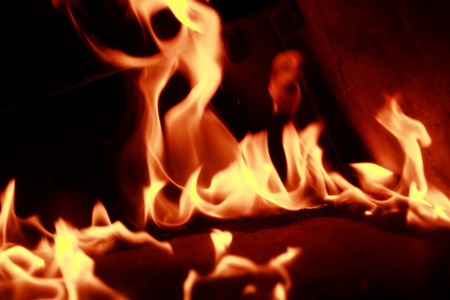 Fire flames with reflection on dark background