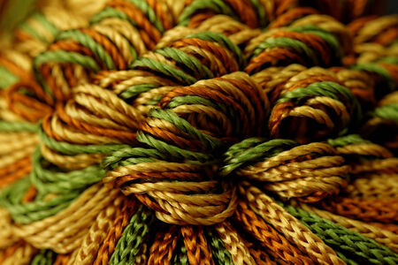 Photo of green, yellow and orange yarnsの写真素材