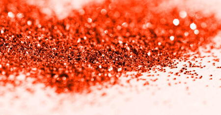 Yellow glitter on light background - macro photoの写真素材