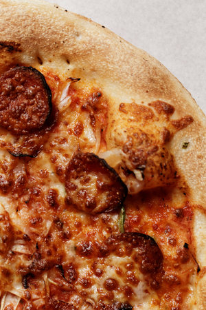 Close up photo of a delicious sausage pizzaの写真素材