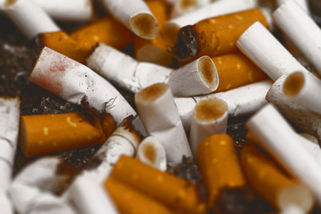 Bad addiction. Ashtray and cigarettes close-up