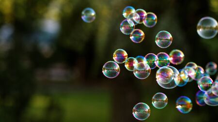 The rainbow bubbles from the bubble blowerの写真素材